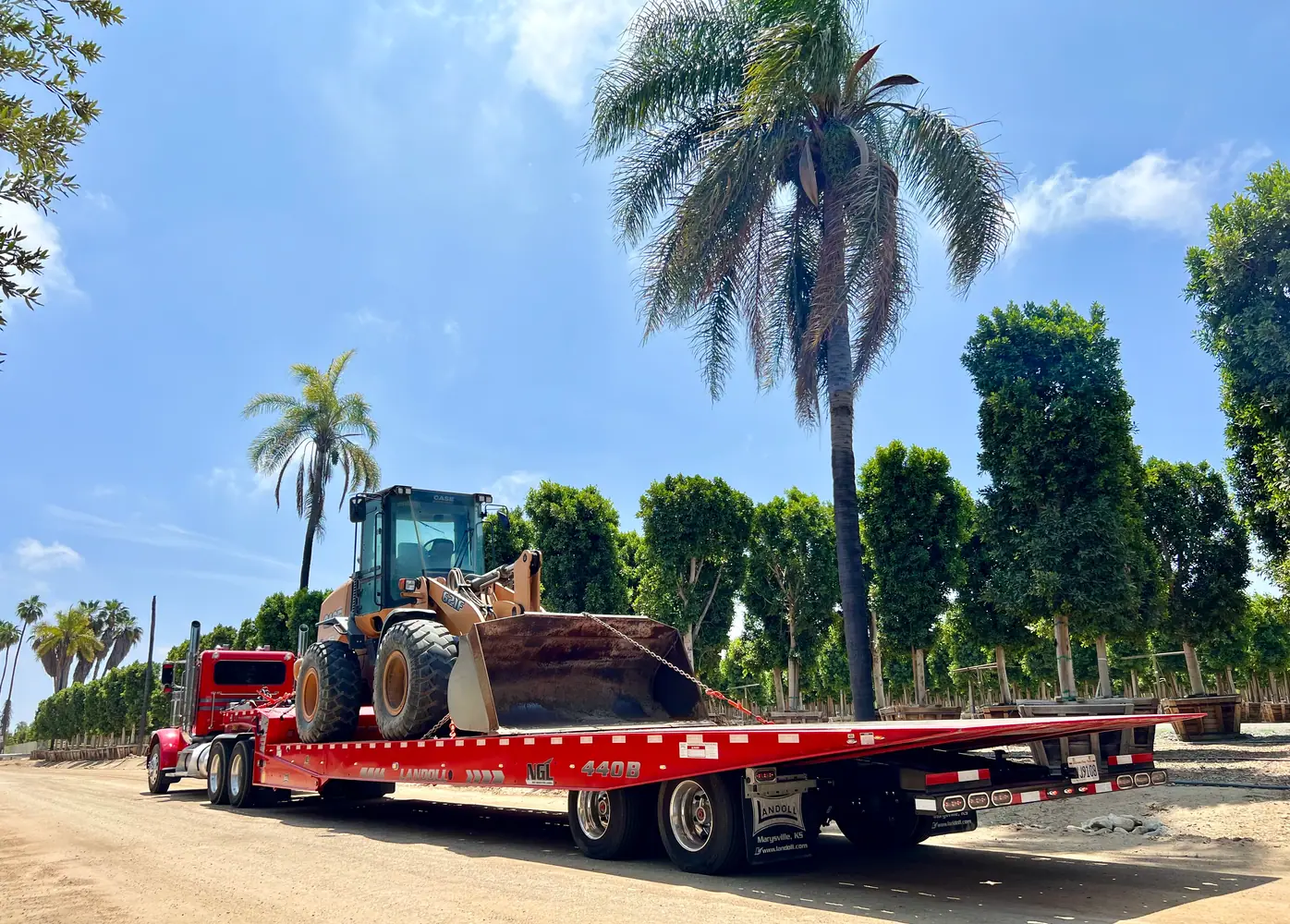 Heavy equipment transport on a flatbed near Lancaster CA